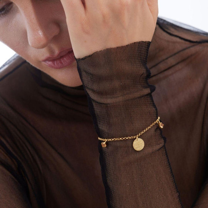Pulsera noise de plata de ley bañada en oro 18k con cristal champán · Victoria Cruz