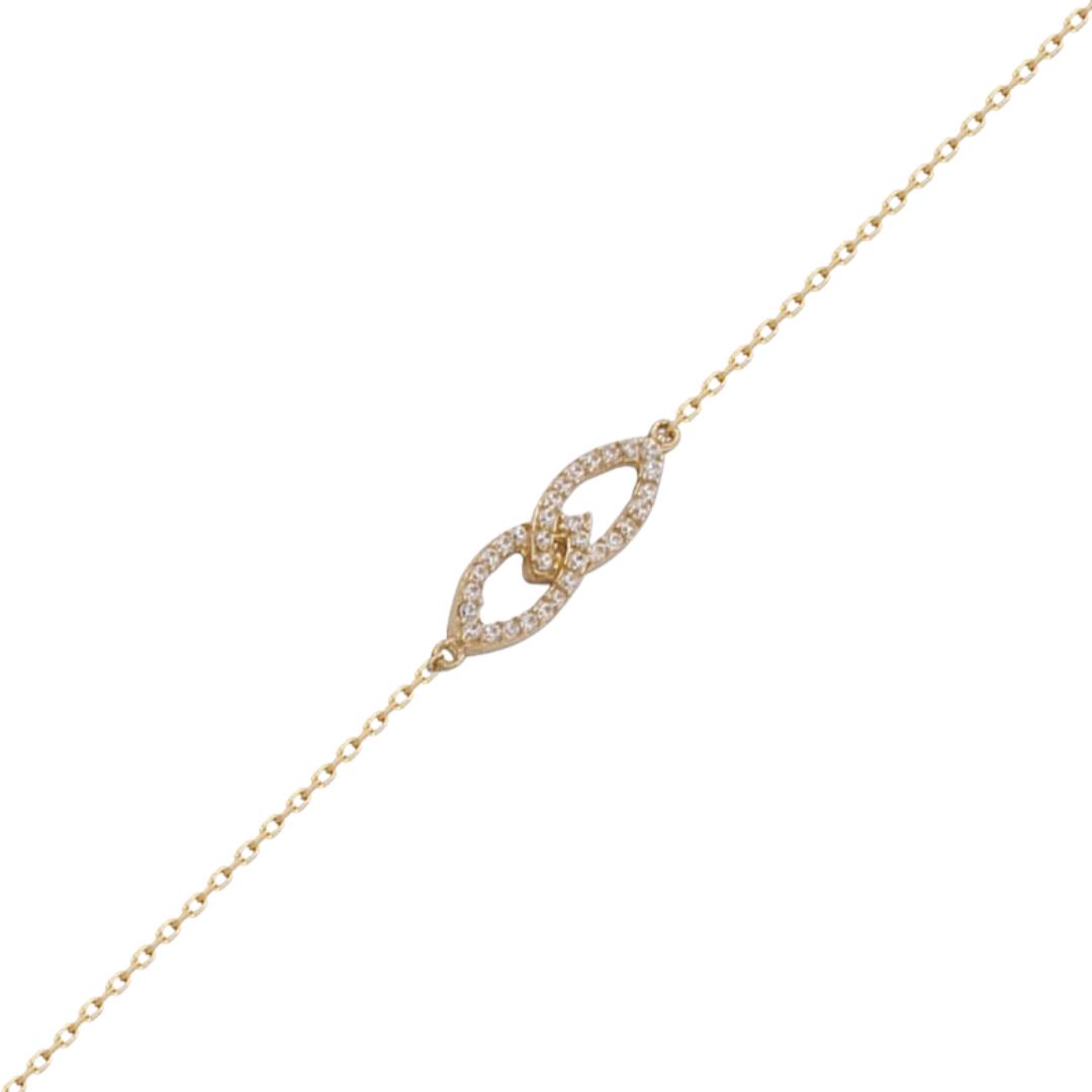 Pulsera de oro amarillo en forma junto infinito con circonitas