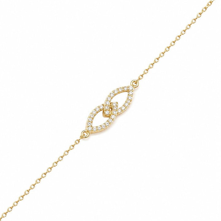Pulsera de oro amarillo en forma junto infinito con circonitas