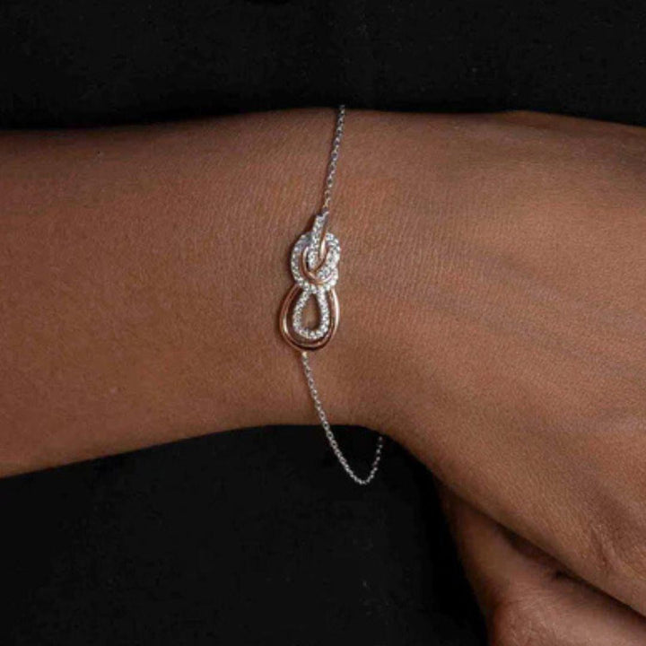 Pulsera "nudo rosa" de plata bicolor